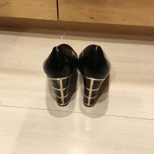Black pumps with gold detailing